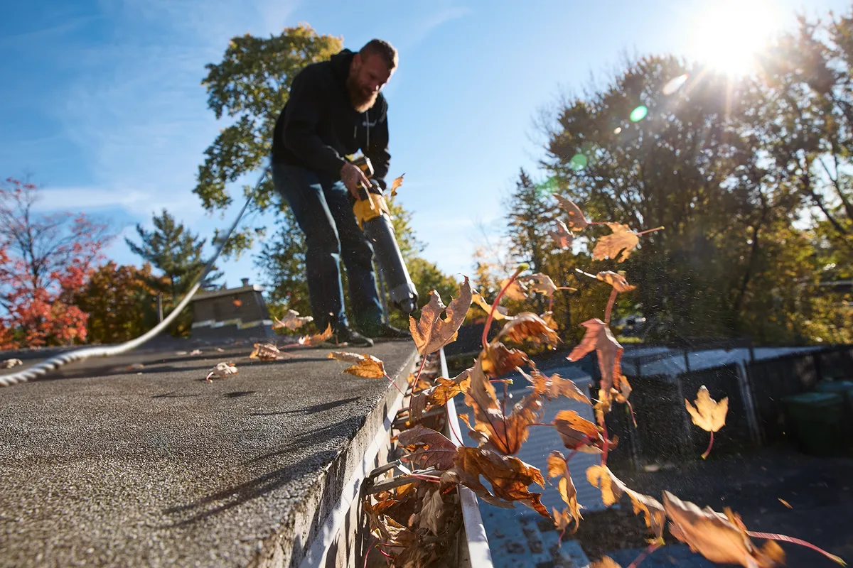 Installer setting new aluminum at the roofline